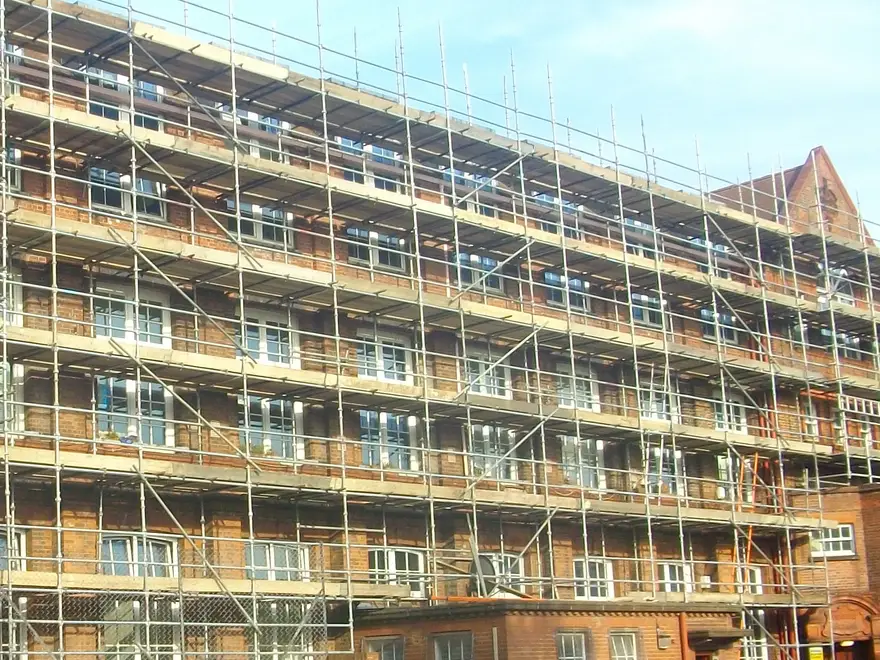 Scaffold lifts at every floor along the main elevation of a Victorian school in Camberley