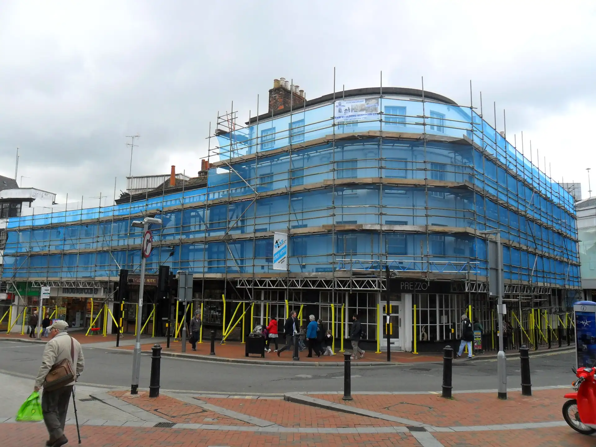 Netted scaffolding around The George Hotel in Reading town centre during external painting